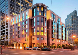 Hotel with illuminated windows on a city street